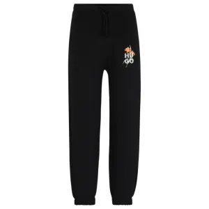 Relaxed-fit tracksuit bottoms with floral logo artwork