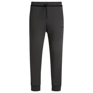 Tracksuit bottoms with tape and logo